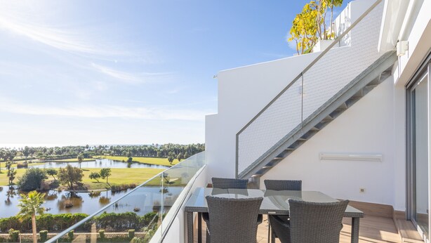 A balcony with a glass railing overlooking a swimming pool and a golf course. - Ref. 491872 (Motril)