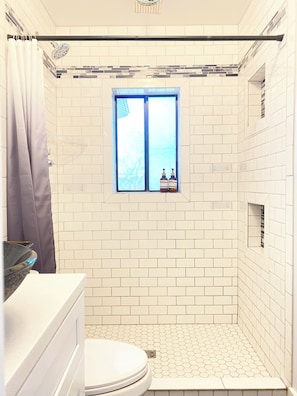 Shower, hair dryer, towels, soap