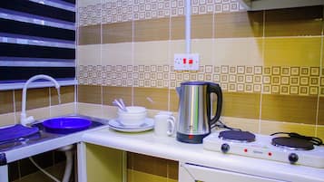 Mini-fridge, cookware/dishes/utensils, paper towels