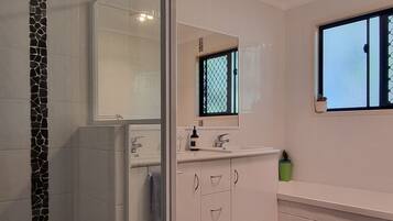 Shower, hair dryer, towels, soap