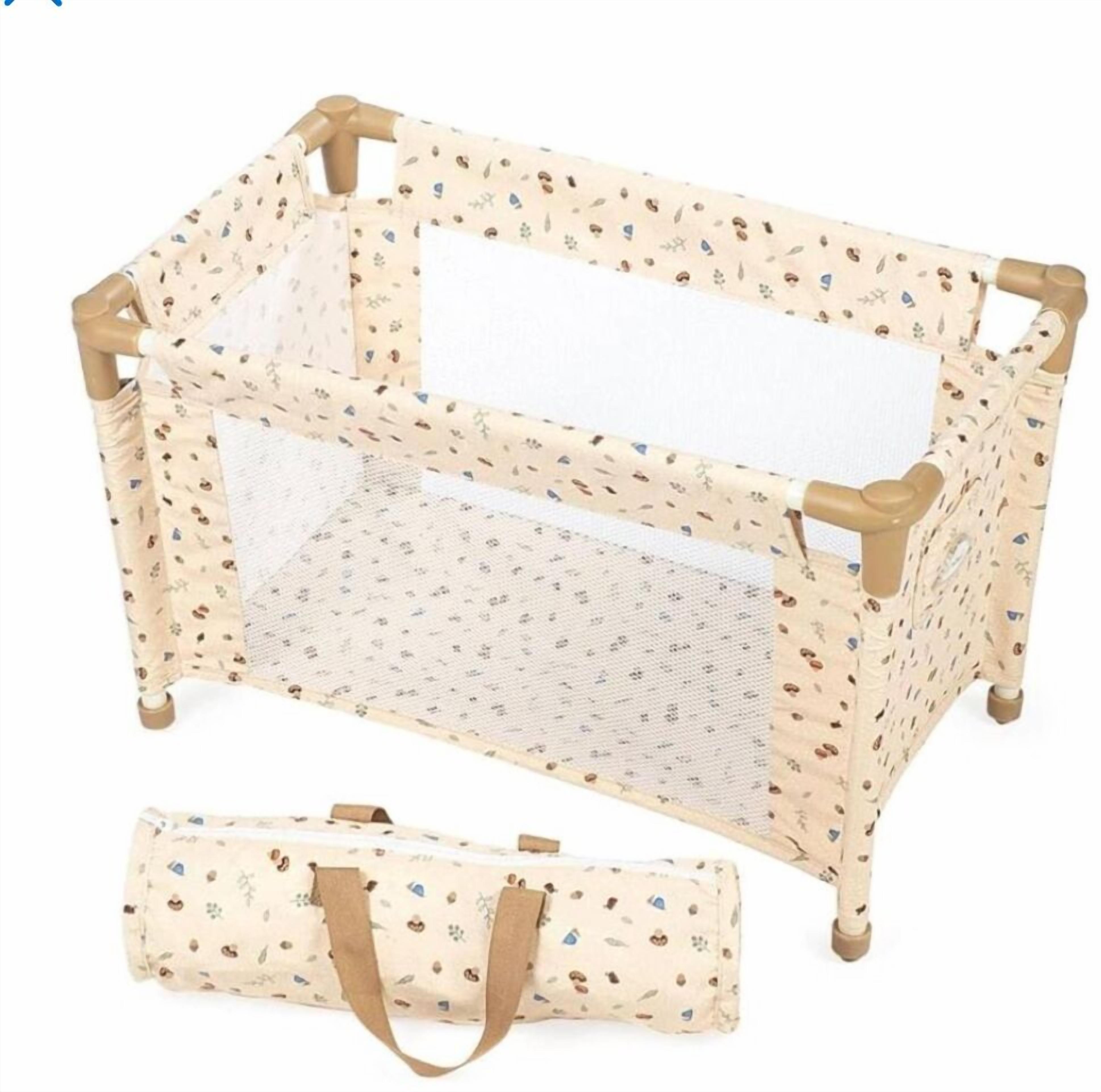 A baby crib with a mesh front and a matching carrying case.