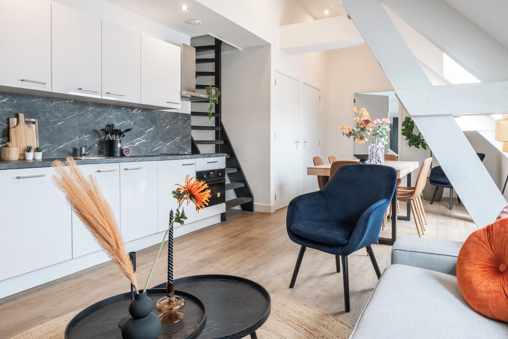 A close-up of the kitchen area adjacent to the dining space, featuring sleek countertops and modern appliances, perfect for culinary adventures.