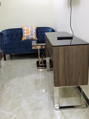 City Studio | Living area | 24-inch Smart TV with digital channels - Lux Suites Denis Prit Studio Apartments (Nairobi)