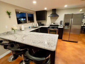 Fridge, microwave, oven, stovetop - Fun-Filled Spacious House: Pool Table, Basketball, Fire Pit, Theater, BBQ & More (Las Vegas)