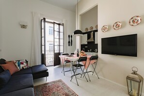 Apartment, 2 Bedrooms | Living area | 30-inch TV with cable channels - Suite La Piazza by Wonderful Italy (Syracuse)