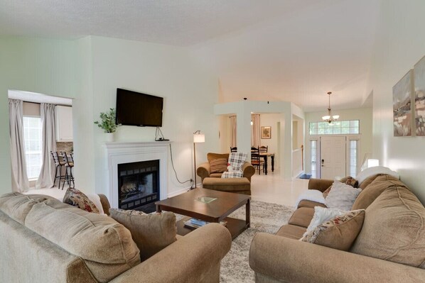 TV, fireplace, books