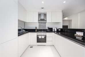 Fridge, microwave, oven, stovetop - Chic 1BR Apartment in Avanti Tower, Business Bay by Deluxe Holiday Homes (Dubai)
