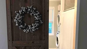 A rustic wooden door with a cotton wreath. - Saratoga Racetrack and SPAC getaway  (Saratoga Springs)
