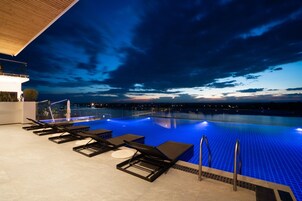 Outdoor pool, open 7:00 AM to 9:00 PM, pool umbrellas, pool loungers