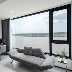 Habitación doble superior, vistas al río | Zona de estar