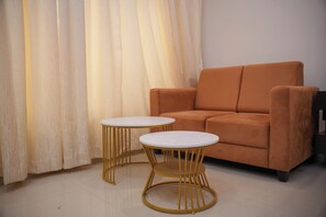 Premium Double Room | Living area | 32-inch TV with satellite channels - THE ON TIME HOTEL Bangalore (Bengaluru)