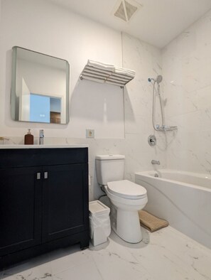 Hair dryer, towels, soap, shampoo