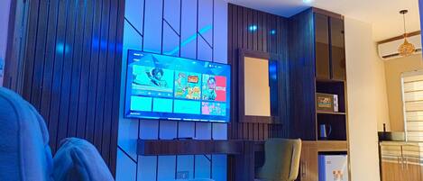 Appartement exécutif | Aire de séjour | Téléviseur