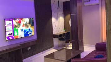 Executive Apartment | Living area | TV