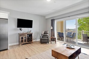 Living area - Experience modern luxury in this high-quality 1-bedroom condo. (Hampton)