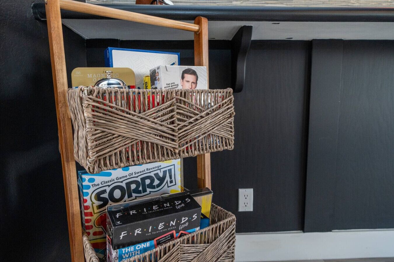 A shelf with a box labeled 'SORRY!' and a box labeled 'FRIENDS.'