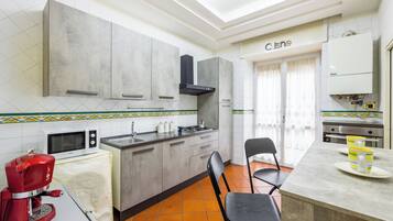 Apartment | Private kitchen | Electric kettle, dining tables