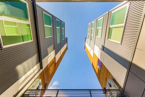 A modern building with a unique perspective looking up at the sky through the windows. - Dancing Wings Retreat Walker Paradise (Seattle)