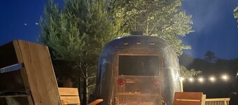 Glamping in Vintage Airstream with modern comforts with private pond access.