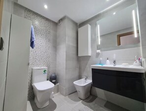 Bidet, towels, soap, shampoo
