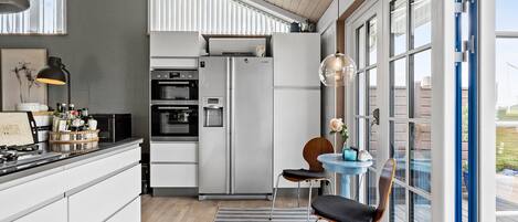 Fridge, stovetop, dishwasher, coffee/tea maker