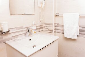 Hair dryer, towels, soap, toilet paper