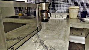 Fridge, microwave, stovetop, coffee/tea maker