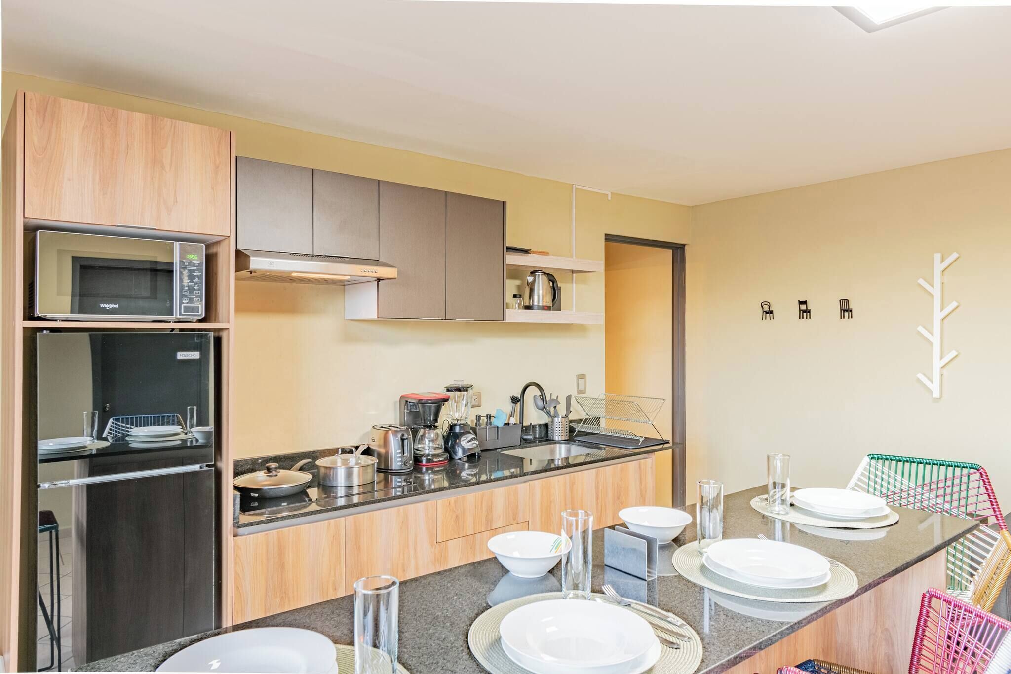 Fridge, microwave, stovetop, coffee/tea maker