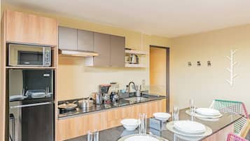 Fridge, microwave, stovetop, coffee/tea maker