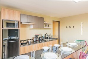 Fridge, microwave, stovetop, coffee/tea maker