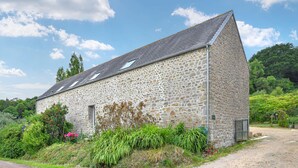 A stone building with a sloped roof and a small window. - Stunning home in La Pernelle with WiFi (La Pernelle)