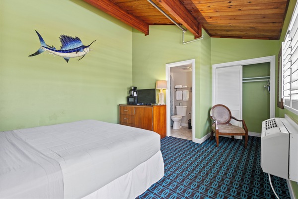 Room 14 is located on the third floor of the Inlet Building. It has a king-size bed and a window overlooking Fort Pierce Jetty Park.