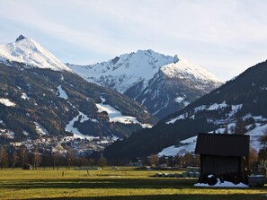 A mountain landscape with a small building in the foreground. - Rübezahl by Interhome (Bad Hofgastein)