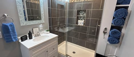Shower, hair dryer, towels, soap