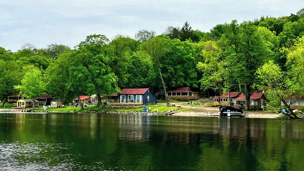 A lakeside cabin community with multiple houses, docks, and boats. - Lakefront Cabin w/ Dock & Kayaks, Fishing Escape
Marine Comfort - Cabin 8 (South Haven)