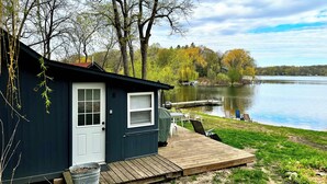 A cabin with a dock extending into a lake, surrounded by trees and a grassy area. - Lakefront Cabin w/ Dock & Kayaks, Fishing Escape
Marine Comfort - Cabin 8 (South Haven)
