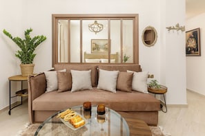 Deluxe Suite, Balcony | Living area