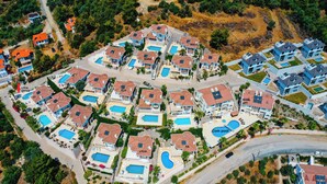 An aerial view of a residential area with multiple houses, each with a swimming pool. - Beautiful Detached Villa With Private Pool And Stunning Views,Walkable to Town. (Dalanan)