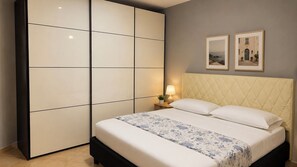 1 bedroom, desk, iron/ironing board, travel crib