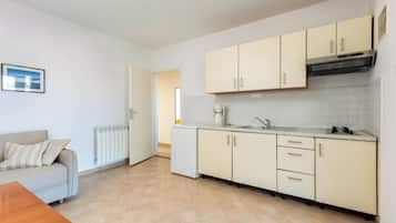 Apartment Lindi A1 - No Pets Allowed | Private kitchen | Full-sized fridge, stovetop, cookware/dishes/utensils, dining tables