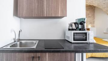 Fridge, microwave, stovetop, coffee/tea maker