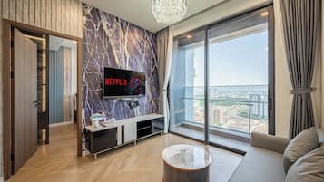 Premium Apartment, City View | Living area | 55-inch Smart TV with premium channels, Netflix, streaming services