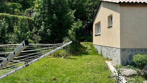 A house with a sloped roof, a small window, and a stone foundation. - Large, comfortable villa in the Cévennes, mountains, lakes and rivers. Pets welcome! (concoules)