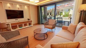 Superior Suite, Non Smoking, Pool View | Living area | 55-inch Smart TV with satellite channels