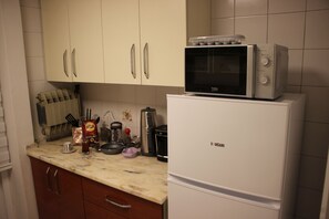 Fridge, microwave, electric kettle, cookware/dishes/utensils