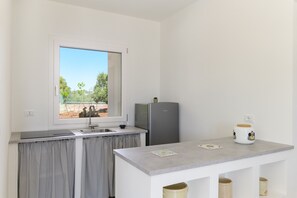 Fridge, cookware/dishes/utensils, dining tables