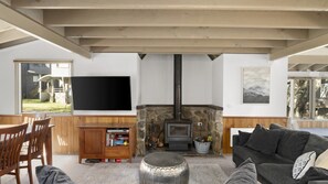 Relax in this inviting living room with a fireplace, flat-screen TV, and comfortable seating area.