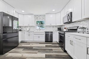 Fridge, microwave, oven, stovetop - Luxury 9 Bedroom Retreat - Heated Pool & Hot Tub (Tampa)