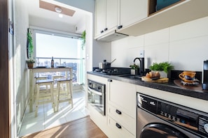 Apartamento | Cozinha privada | Geladeira, micro-ondas, máquina de café expresso