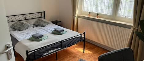 1 bedroom, desk, iron/ironing board, travel cot